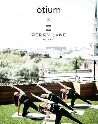 During warmer months, we offer Vinyasa yoga classes on the rooftop of the Perry Lane Hotel!