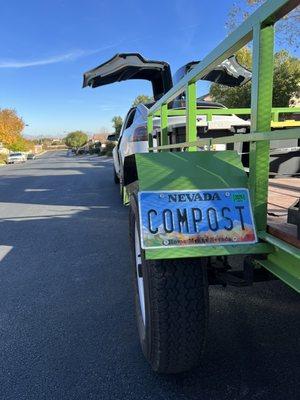 Using the Tesla and our bright green trailer for zero emission food waste pickup!