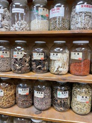 Chinese herbs in glass jars. There were at least 100 bottles lining the walls!