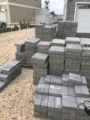 Huge piles of pavers on my front yard for my neighbors to enjoy since may.