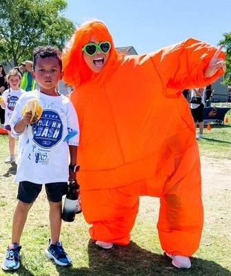 Photo of my son after doing 36 laps for our school fundraiser and his crazy, fun, principal.