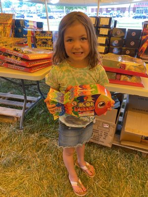 An adorable customer and her very favorite firework.