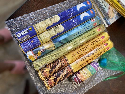 Moon, success, money, and Palo Santo incense along with a chakra sage and blue howlite crystal.