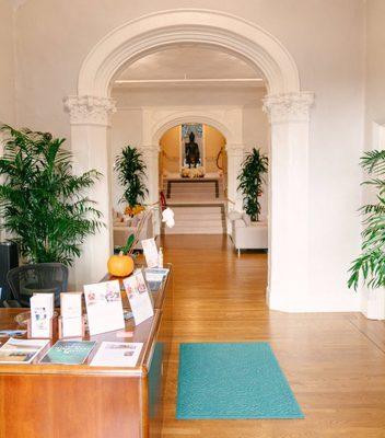 The front desk, and stairway to Dharma College