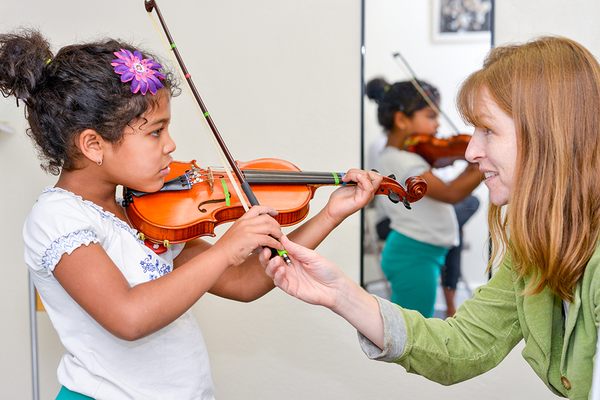 Violin lesson -- lessons for all string instruments are available as well as Suzuki instruction