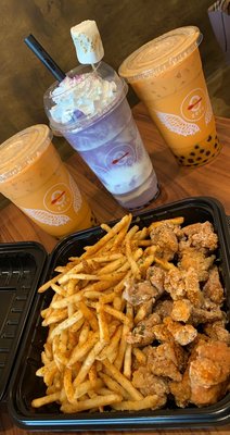 Spicy popcorn chicken with Cajun fries, Thai Tea with boba & Taro Smoothie with boba