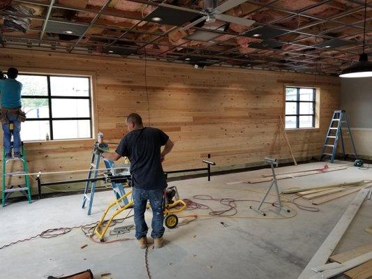 Interior Framing with Fine Carpentry to include T&G wall panels and Corrugated Metal on bottom half walls. Sonnys BBQ OBT