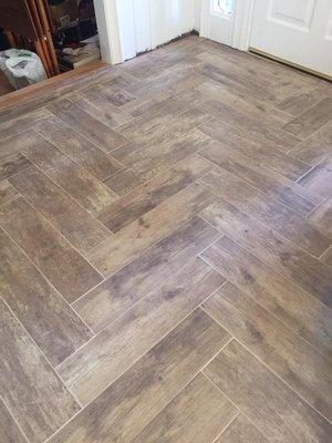 Herringbone tile floor installation