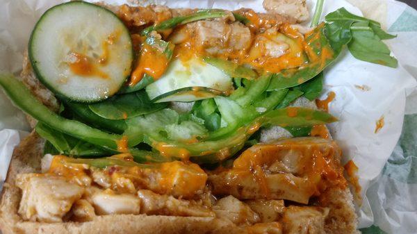 Sweet onion chicken teriyaki with green bell peppers onion cucumber spinach sriracha mayo