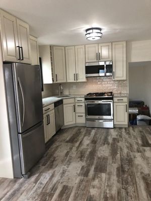 Custom kitchen,wood look porcelain tile floor.