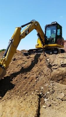 Excavating for a new silo, which will be part of a new non traditional home.