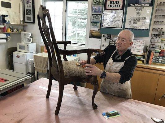 Victor Galko repairing an antique chair