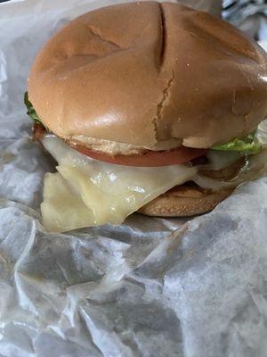 Mushroom and Swiss burger with lettuce and tomato