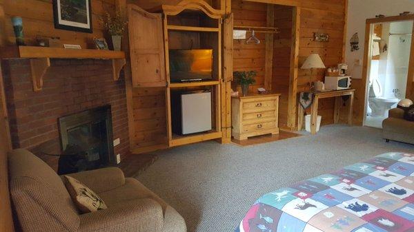 Seating, gas fireplace, flat screen tv, fridge, microwave, coffee