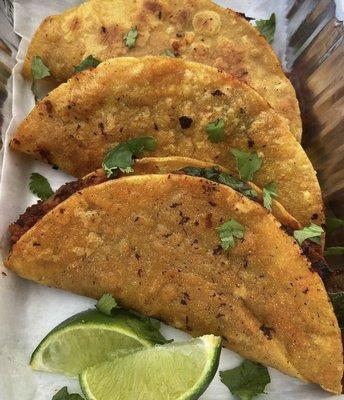 Jae Rock Tacos (BEST EVER VEGAN TACOS) Plant based ground beef and mild salsa garnished with fresh cilantro and lime.