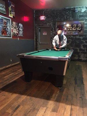 Hole in the wall , but one of the only pool tables you will find on UKs campus that I know of.