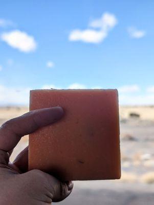 Lillie's Handmade Soaps' New Mexico Mango Salsa bar soap ft. New Mexico scenery & cornflower sky in the background