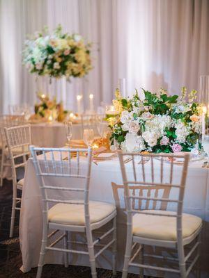 Floral centerpieces in white and blush at reception.