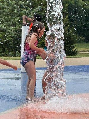 The dumping bucket catches Emily at the Harry Myers Splash pad.