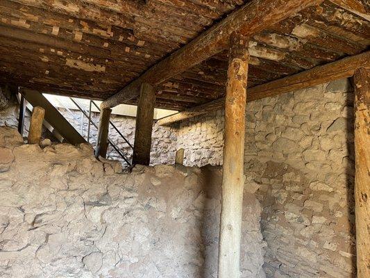 Inside. Note how the logs hold up the roofs.