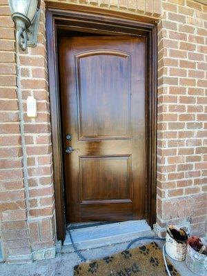 Wood grained metal door.