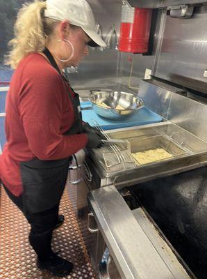 Suzie working the fryer.