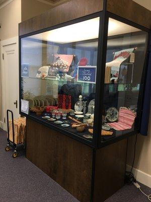 We have a display case that often features the works of art/crafts of local artisans.