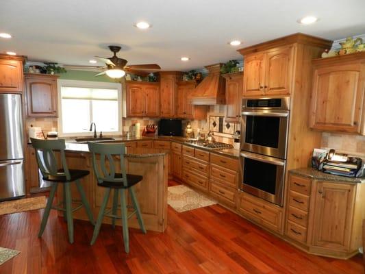 Warm and comfortable designed space with Knotty Alder rustic cabinetry & granite tops.