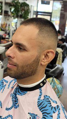 Mid.high skin.fade 2 on top with the fade into the beard