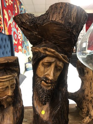 Wooden Jesus face craved into a log