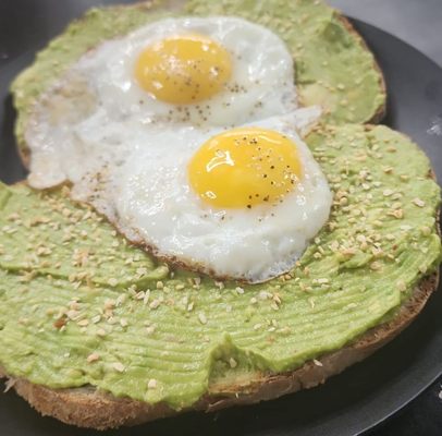 Avacodo toast with perfectly cooked eggs.