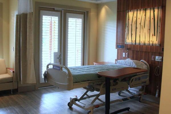 Patient rooms have French doors that open to the outside garden at Lower Cape Fear Hospice's SECU Hospice House of Brunswick.