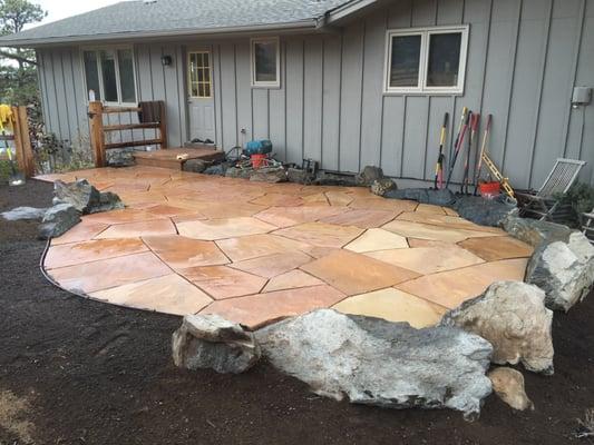 Another custom stone patio with boulder border for height and contrast