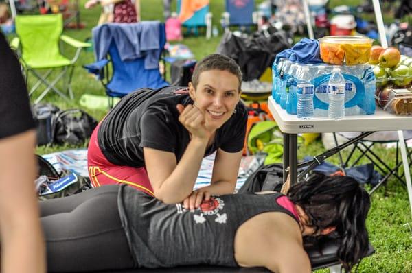 Claire working on a crossfit athlete at Flex on the Mall event.