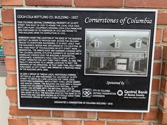 Plaque outside the record shoppe explains the history of the building.