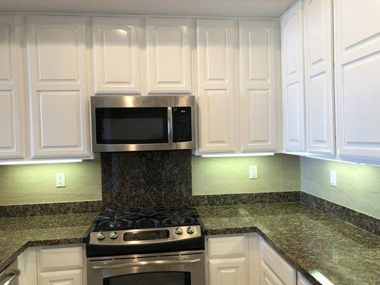 New white cabinets (originally dark cherry wood color)