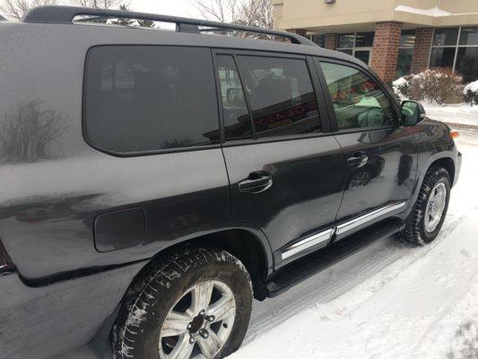 My damaged SUV with the rear tire temporarily put back on.