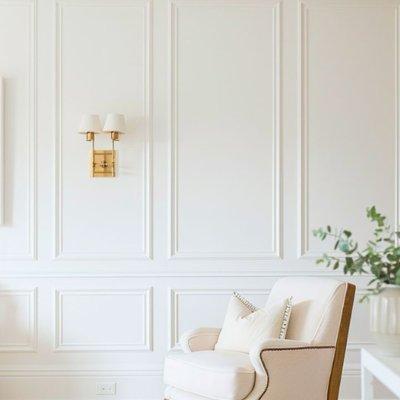 Elegant interior design featuring sophisticated wall paneling and moldings that bring depth and character to the room.