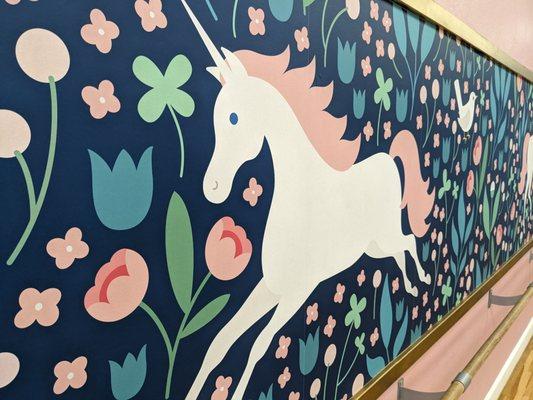 Beautiful painted walls of the Storybook Dance studio with flowers, unicorns and birds.