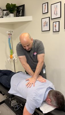 Dr. Eisen performing a Chiropractic adjustment.