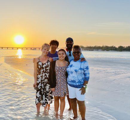 Sunset family pic, with bridge to Longboat Key in background