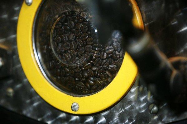 100% premium arabica coffee beans in the roaster. This window allows us to see the color change as the coffee beans heat up!