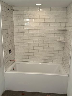 Tile tub surround with two corner shelves