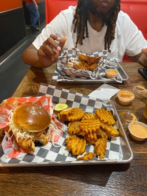 Crispy chicken sandwich (spicy) with waffle fries.