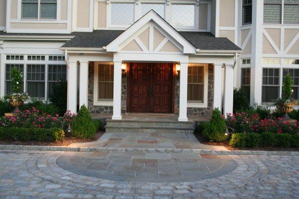 Front entry walk detail with bluestone inlay in driveway.