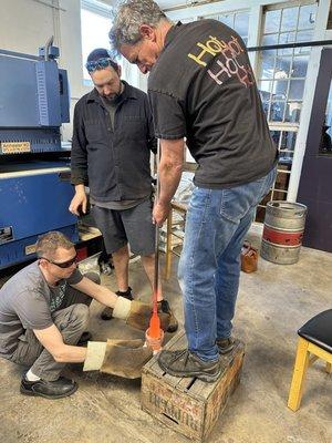 Instructors Brian Frus (left), Carmi Katsir (center), and David Jacobson (right) working together on a glass blowing project