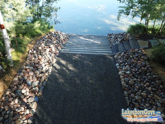 Concrete boat ramp, staircase to lake, and riprap shoreline