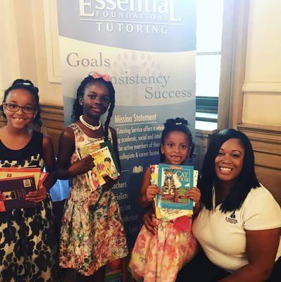 Distributing free books to scholars at the Daddy Daughter Gala hosted at Trinity University!