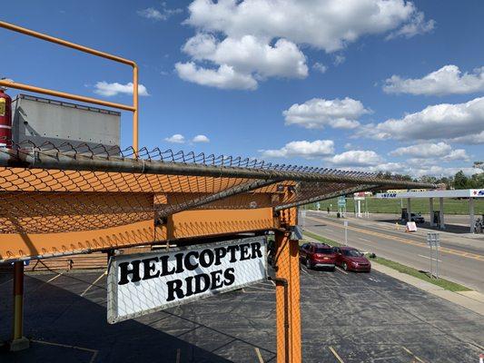 Rainbow Helicopter Rides Signage