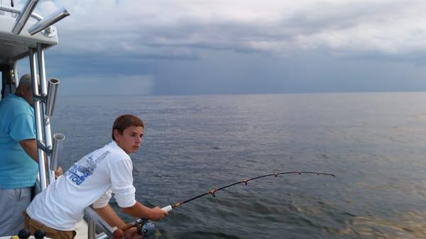 Young angler catching his 1st fish